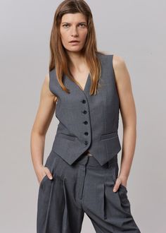 Color: Dark Grey MelangeLightweight traditional suiting fabric Fitted waistcoat Button front closureWelt front pockets Adjustable buckle backLined65% Lyocell 25% Rayon 10% WoolDry CleanBy The Frankie Shop. Imported Minimalist Korean Fashion, Waistcoat Outfit Women, Fitted Waistcoat, Grey Waistcoat, Waistcoat Outfit, The Frankie Shop, Suiting Fabric, Stylish Work Attire, Frankie Shop