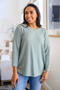 Elevated basics like the Waffle Knit Basic Top In Sage are essential to your year round wardrobe! Lightweight, waffle knit shapes this reversible top. Featuring a round neckline with long dolman sleeves and a rounded hem. The opposite side has a cut out detail that drops into a ruched detail with functional drawstrings. Lightweight Stretchy + Reversible 85% Polyester, 11% Rayon, 4% Spandex Wash cold, hang dry True to size *Measurements listed below are of the actual clothing item* S: Chest 40" L Georgia Fashion, Round Wardrobe, Reversible Top, Elevated Basics, Holiday Tops, Basic Tops, Waffle Knit, Dolman Sleeve, S Models