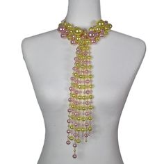 Elegance and style in our Pearl Tie Necklace. Pair with your favorite blouse or Dress. This statement piece does all the talking. Each necklace includes a matching pair of earrings. Spring Party Choker Necklace, Chic Beaded Necklaces For Party, Elegant Multi-strand Bib Necklace For Party, Spring Party Multicolor Beaded Necklaces, Spring Multicolor Beaded Necklace For Party, Elegant Green Necklace For Spring, Chic Multicolor Necklaces For Party, Elegant Long Bib Necklace For Party, Elegant Yellow Long Beaded Necklaces