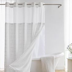 a white bath tub sitting next to a window