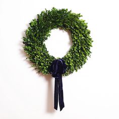 a green wreath hanging on the wall