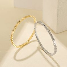 Durable and stylish, our waterproof bracelet is crafted for both functionality and fashion. Perfect for any occasion, it's the ideal accessory for those who appreciate durability and timeless elegance. Perfect for the minimalist and a beautiful piece to layer with. - 18K gold plated / stainless steel - Waterproof technology - Bangle opens and measures 56mm inner diameter. - 3mm in width. - Cubic Zirconia - Stackable Dainty Stainless Steel Jubilee Bracelet, Everyday Stainless Steel Jubilee Bangle, Trendy Gold-plated Tarnish-resistant Bangle, Minimalist Stainless Steel Oyster Bracelet, Dainty Yellow Gold Stainless Steel Bracelets, Minimalist Yellow Gold Stainless Steel Bangle, Adjustable Yellow Gold Stainless Steel Bangle, Minimalist Stainless Steel Gold Bracelet, Tarnish Resistant, Minimalist Stainless Steel Bangle With Jubilee Bracelet