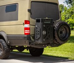 an off road vehicle parked in the grass