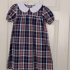 Nwot Beaufort Bonnet Company Red And Blue Plaid Dress With White Peter Pan Collar. Adorable Plaid That Is Perfect For Memorial Day, Labor Day 4th Of July Or Family Pictures. Size 8, But Easily Could Work For Size 6-10. Perfect For Back To School Too! Such A Classic Dress. Monogram On The White Peter Pants Collar Would Be Adorable. Blue Long Sleeve Preppy Dress, Plaid Short Sleeve Dress For School, Navy Short Sleeve School Dress, Red Short Sleeve School Dress, Preppy Short Sleeve Dresses For School, Preppy Short Sleeve School Dress, Fitted Blue Preppy Dresses, Preppy Blue Dresses For School, Fitted Multicolor Dress For School