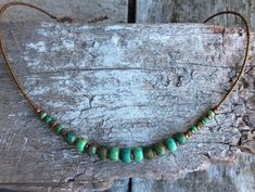 ✦Gorgeous handmade and eye catching, picasso Czech glass opaque beads in a variety green and turquoise, single strand short style necklace, copper plated brass spacer, antique plated copper clasp with extension chain is a delight. ✦ I have created this piece with inspiration from tribal cultures around the world, while adding a modern unique feel. ✦Length of necklace 43cm (17") approximately, plus a 4.5cm (1 3/4") extension chain. ✦ 100% artisan made. Cheap Green Bohemian Turquoise Necklace, Hippie Green Festival Jewelry, Green Hippie Festival Jewelry, One Of A Kind Adjustable Choker Necklace, One-of-a-kind Adjustable Choker Necklace, Green Bohemian Choker For Festivals, Bohemian Wire Wrapped Jewelry, Adjustable Wire Wrapped Bohemian Necklaces, Handmade Turquoise Choker For Festivals