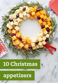 a christmas wreath made out of cheese and olives