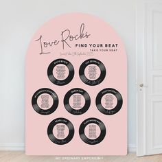 a pink poster with black vinyl records on it and the words love rocks find your beat take your seat