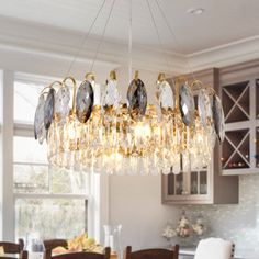 a chandelier hanging from the ceiling in a kitchen