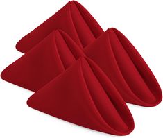 three pieces of red cloth folded in the shape of triangulars on a white background