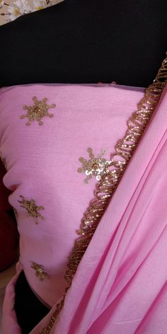 Color : Pink Fabric - Chinon This Ruffled Saree has beautiful Crystal Scallop trim at the hemline. Length of Saree 48 inches. Blouse : Pink Emroidered Net with Silk Lining The blouse and underskirt/petticoat will be stitched as per the measurements provided IF YOU WISH TO PURCHASE THIS WE CAN SEND A VIDEO ON YOUR WHATSAPP NUMBER FOR BETTER UNDERSTANDING OF THE SAREE Fabric Care : Dry Clean Only Disclaimer: The actual color of the product might slightly differ from the image due to photographic l Traditional Drape Blouse Piece With Gota Work For Reception, Gota Work Blouse Piece For Reception With Traditional Drape, Unstitched Gota Work Blouse Piece For Reception, Silk Blouse Piece With Gota Work For Reception, Celebration Silk Lehenga With Mirror Work, Silk Lehenga With Mirror Work For Celebration, Fitted Georgette Blouse Piece With Gota Work, Pink Blouse Piece In Tissue Silk With Gota Work, Elegant Georgette Blouse With Gota Work