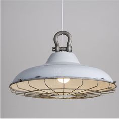 a white light hanging from a ceiling fixture