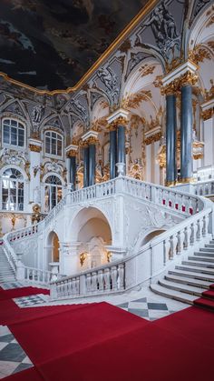 an elaborately decorated building with red carpet and stairs