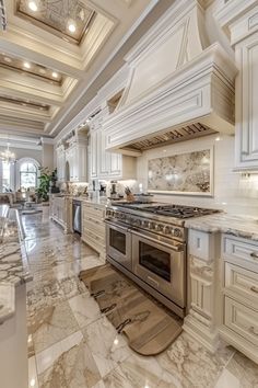 a large kitchen with marble floors and white cabinets