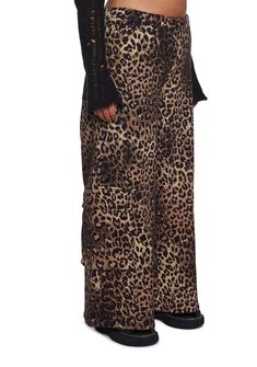 These pants have a stretchy twill construction with an all-over leopard print, a wide leg, cargo pockets on the legs with snap button closures, front and back pockets, and a front button and zipper closure. Dolls Kill Outfits, Wide Leg Cargo Pants, Y2k Fashion, Dolls Kill, Exclusive Collection, Tank Dress, Snap Button, Cargo Pants, Online Boutique