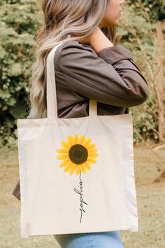 Perfect gift for sunflower lovers! What's more, you can now customize your name. These Port Authority® personalized tote bags are in the size of 15.75"h x 15.25"w and with a handle length of 21.5", with 100% cotton sheeting. Add their reinforced handle stitching to the mix, and you got a reliable bag rich in both practicality and durability. ✔ Material: 100% cotton sheeting ✔ Lightweight and compact ✔ Handle Length: 21.5" (54.61cm) ✔ Reinforced handle stitching ✔ Printed in USA ----------------- Tot Bags Design, Cotton Tote Bags Design, Custom Tote Bags Painting, Tote Bag Painting Ideas Flowers, Tote Bags Painting Ideas, Tot Bag Design, Paint A Tote Bag, Easy Tote Bag Painting, Bag Print Design