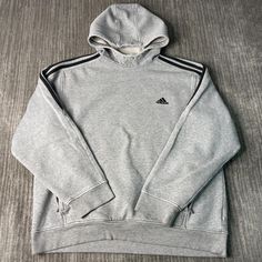 Vintage 2000s Adidas Two Pockets Three Stripes Sportswear Athletic Y2K Aesthetic Grey Graphic Hoodie Extra Large Mens Condition:  Fair Used Condition  = Staining On The Front Of The Sweatshirt Due To Age And Wear  Measurements: Please see photos above for all measurements IF YOU BUY TWO OR MORE ITEMS USE THE CODE BUNDLE @ CHECK TO SAVE 20% WE SHIP WITHIN 24 HOURS AFTER PURCHASE! Please be aware that we do not offer free returns!! The Buyer is responsible for the cost of the return label. Follow Sporty Hoodie For Sports, Sportswear Fleece Hoodie With Three Stripes, Fleece Sweatshirt Hoodie With Three Stripes Branding, Sporty Activewear With Double-lined Hood For Streetwear, Sporty Double-lined Hooded Activewear For Streetwear, Urban Sports Hoodie With Moisture-wicking, Adidas Fleece Hoodie Sportswear, Sports Season Hoodie Sweatshirt, Sportswear Fleece Sweatshirt With Three Stripes