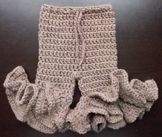 a pair of crocheted pants with ruffles on the bottom