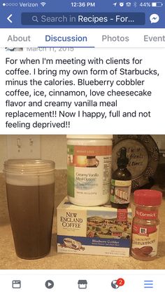 a cup of coffee sitting on top of a counter next to other items