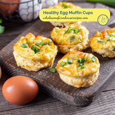 egg muffin cups on a cutting board next to eggs