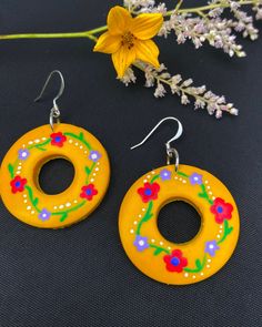 THE 'OMA'. 🌼  These statement yellow earrings are the touch of color that your earring collection needs.  HANDMADE & HAND-PAINTED, these earrings are made with thought and care. Available with gold plated,  silver plated, or sterling silver, for an additional cost.  Limited quantity available.  All earrings in this collection are named after real-life grandmothers, because who knows accessories better than them? 👵 Handmade Yellow Circle Earrings, Hand Painted Yellow Jewelry For Gift, Artistic Yellow Jewelry With Matching Earrings, Traditional Yellow Round Earrings, Hand Painted Yellow Artsy Earrings, Yellow Hand Painted Artsy Earrings, Artsy Yellow Jewelry With Ear Wire, Traditional Yellow Hand Painted Jewelry, Unique Hand Painted Yellow Jewelry