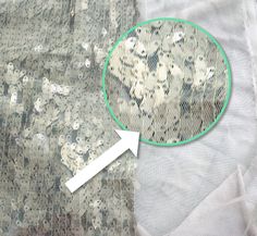 a close up of a piece of cloth with an arrow pointing to it