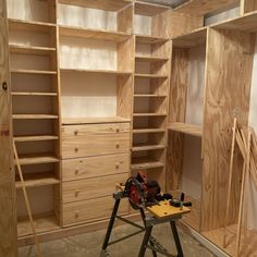 a workbench is being used to build shelves in a closet with plywood