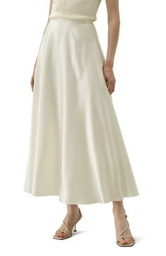 This exquisite 100% silk flowy maxi skirt is a testament to refined style and elegance. The sway of the fabric is mesmerizing, gracefully moving with your every step. The fluid sheen of the silk reflects light in a delicate, captivating manner. 100% silk Flowy maxi skirt Sway to mesmerize White skirt offers extra inner layer Fluid Sheen Maxi Silk Skirt, Hankerchief Skirt, Flowy Maxi Skirt, Silk Pajamas Women, Flowy Maxi Skirts, Silk Maxi Skirt, Camisole Set, High Rise Skirt, Latest Skirts