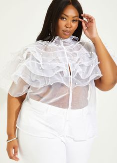 Made from crisp organza, this ruffled shirt is made for a slightly loose fit with waves of tiered ruffles and pops of pearl decoration. Short Sleeve Ruffled Tops For Wedding, Short Sleeve Ruffle Top For Wedding, Short Sleeve Wedding Top With Ruffles, Chic Party Blouse With Pearl Buttons, Cheap White Ruffled Shirt, Summer Organza Blouse With Ruffles, Summer Organza Tops With Ruffles, Chic White Organza Tops, Spring Organza Blouse With Ruffles