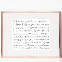 a handwritten poem in black ink on a white background with a gold framed frame