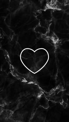 a black marble background with a white heart