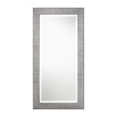 a white and grey framed mirror on a wall with a gray border around the edge