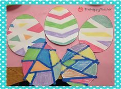 some paper plates are sitting on a table with other items in front of the wall