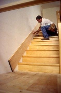 a man is working on some stairs