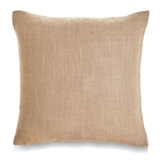 a beige pillow on a white background