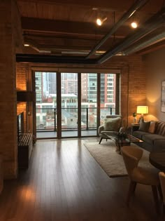 a living room filled with furniture and a large window