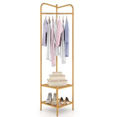 a gold garment rack with shoes and shirts hanging on the racks, all in different colors