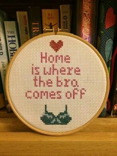 a cross stitch pattern with the words home is where the dog comes off