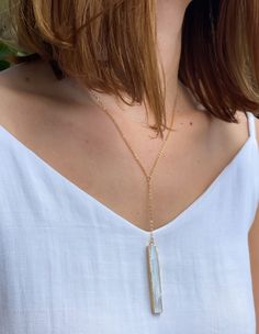 This delicate necklace features a natural selenite crystal wand, 14k Gold Plated dainty 925 Silver chain. Selenite is a calming stone that instills deep peace and is excellent for meditation or spiritual work.

 	Chain: 18K Gold Plated Sterling Silver
 	
Closure: Lobster claw
 	
Style: Boho & Minimalist
 	Model is pictured wearing 18" White Moonstone Necklace With Delicate Chain, Dainty White Crystal Necklace With Delicate Chain, Everyday Delicate White Crystal Necklace, White Long Drop Necklace With Delicate Chain, White Dainty Crystal Necklace With Natural Stones, White Crystal Necklace With Delicate Chain For Gifts, White Crystal Necklace With Delicate Chain As Gift, Dainty White Crystal Necklace With Natural Stones, Delicate White Crystal Necklace With Delicate Chain