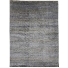 an area rug with grey and white stripes on the bottom, in front of a white background