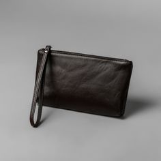 Mens wristlet is handmade in our Ukrainian factory using cowhide leather which is both durable and a sign of true quality. Offering plenty of space for your daily essentials. There are 3 interior compartments. 3 slots for credit cards. This leather purse features a wrist strap. Leather wallet is the perfect bag for the businessman who desires a simple leather accessory which will still carry all of his daily necessities. It is a clutch wallet with an effortless, contemporary design. Details: Col Business Clutch Wallet With Mobile Phone Bag, Classic Pouch Wallet With Wrist Strap, Classic Wristlet With Zipper, Business Clutch Wallet With Zipper Pouch, Classic Wristlet With Zipper Pouch For Daily Use, Business Wallets With Zipper Pouch, Brown Minimalist, Men Clutch Bag, Leather Messenger Bag Men