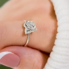 Embrace the beauty of nature with our 3D-printed Rose Ring. This intricately crafted piece captures the essence of a blooming rose, making it a stunning accessory for flower enthusiasts and nature lovers alike. Whether as a gift or a treat for yourself, this delicate and dainty ring is sure to make a lasting impression. Size: Varies by size about 2.5-3.5 tall and 1.2-1.3 thick