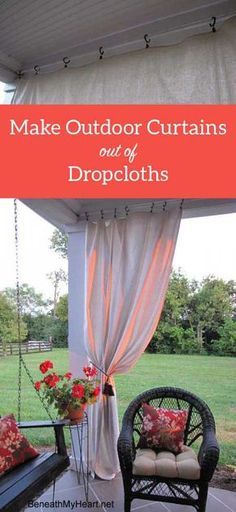 an outdoor curtains and drapes on a porch with flowers in the vases next to it