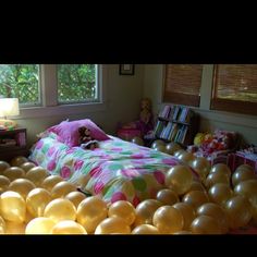 a bedroom with balloons all over the floor