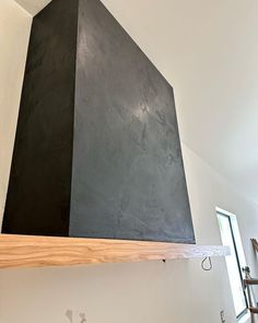 a black stove top mounted to the side of a wall