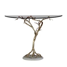 a glass table with branches on it