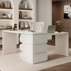 a white desk with a laptop on it in front of shelves filled with vases