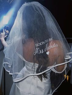 a woman wearing a veil with the words, soon to be mrs india written on it