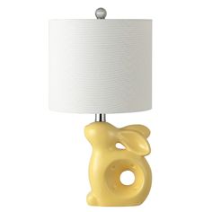 a yellow bear lamp with a white shade on it's head and bottom part