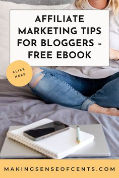 a woman sitting on a bed with her laptop and notebook