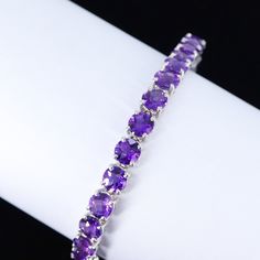 Natural Amethyst Bracelet, 925 Sterling Silver Bracelet, Round Cut Amethyst, Tennis Bracelet, Amethyst Silver Bracelet, February Birthstone >>Handmade Item >>Material : 925 Sterling Silver >>Gemstone : Natural Amethyst ( Checker Cut ) >>Bracelet Length : 7.5 Inch Approx (With Closure) >>Bracelet Width : 6 mm Approx >>Bracelet Weight :  16.800 Gram Approx >>Closure : Open Box >>Style : Minimalist All the designs are crafted by londonjewellers, its our original designs and mostly of them are ready in the stock, we are using Pure 925 (Stamped) Sterling Silver with Gemstones, our jewelry designs are Handmade. We are adding new creative designs in our shop regularly, for new handmade stuff please visit our shop : https://www.etsy.com/in-en/shop/londonjewellers?ref=shop_sugg We always try to pro Elegant Silver Tennis Bracelet, Elegant Amethyst Crystal Bracelet With Stones, Formal Amethyst Bracelets With Gemstone Accents, Sterling Silver Amethyst Bracelet With Gemstone, Round Amethyst Bracelets With Gemstone Accents, Purple Round Fine Jewelry Bracelets, Sterling Silver Amethyst Bracelet For Formal Occasions, Purple Gemstone Bracelets Fine Jewelry, Elegant Amethyst Gemstone Crystal Bracelet